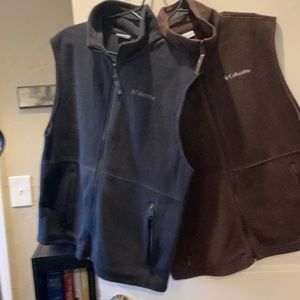 One brown 100% polyester, one black large Columbia sports vest $40 each
